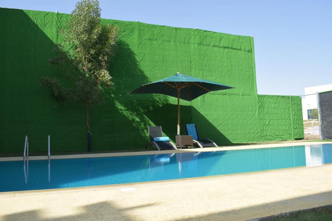 Retaj Salwa Resort & Spa Doha Ngoại thất bức ảnh A swimming pool in Spain