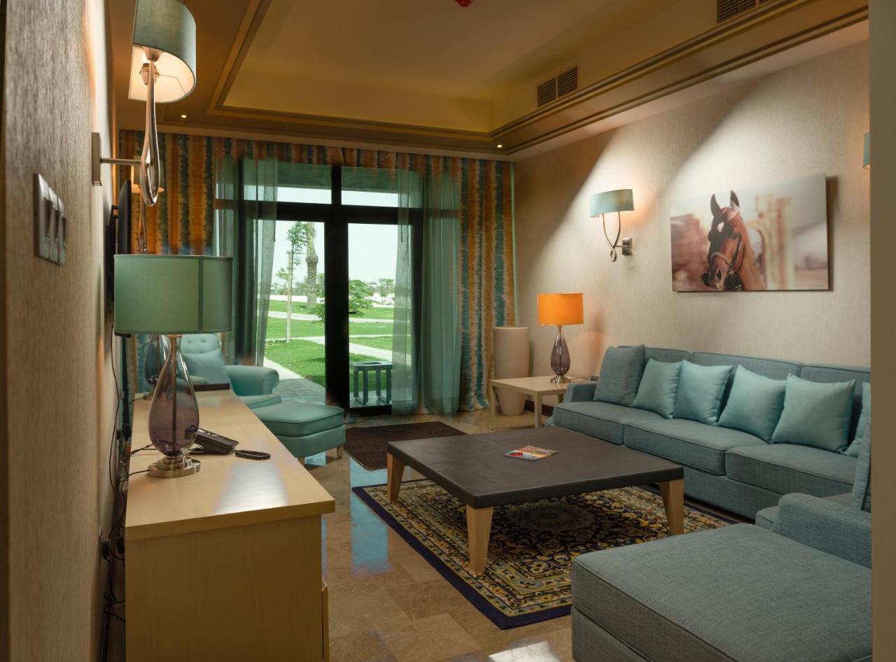 Retaj Salwa Resort & Spa Doha Ngoại thất bức ảnh A living room in a suite at the Ritz-Carlton, Dubai